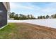Large backyard with white vinyl privacy fence and plenty of room for outdoor activities and landscaping at 124 Alta Crest Ln, Garner, NC 27529