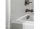 Close-up of a brushed nickel bathtub faucet and fixtures in a modern bathroom at 124 Alta Crest Ln, Garner, NC 27529