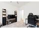 This bedroom is currently set up as a gaming room, complete with carpeted floors at 124 Alta Crest Ln, Garner, NC 27529