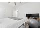 White bedroom featuring a platform bed, a small desk, and a gray exercise ball on top of a treadmill at 124 Alta Crest Ln, Garner, NC 27529