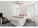 Bright bedroom with neutral walls, large window, ceiling fan, with light gray carpet and king bed at 124 Alta Crest Ln, Garner, NC 27529