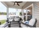 Inviting covered patio with stylish outdoor seating and ceiling fan, perfect for relaxing and entertaining at 124 Alta Crest Ln, Garner, NC 27529