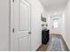 Bright entryway with hardwood floors, white walls, and decorative accents. A lovely welcome to the home at 124 Alta Crest Ln, Garner, NC 27529