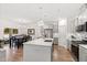 Modern open-concept kitchen and dining area with stainless steel appliances and pendant lighting at 124 Alta Crest Ln, Garner, NC 27529