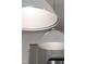 Close-up of large modern pendant lighting above an island in a beautifully remodeled kitchen at 124 Alta Crest Ln, Garner, NC 27529