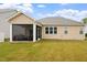 Exterior view of the screened porch, showcasing the seating area and access to the backyard at 124 Alta Crest Ln, Garner, NC 27529
