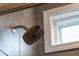 A brushed nickel Delta shower head is featured in this bathroom with tile walls at 124 Alta Crest Ln, Garner, NC 27529