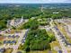 Aerial view of the neighborhood showcasing the lush greenery, water features, and homes at 1355 Bowling Road, Fuquay Varina, NC 27526
