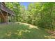 Lush backyard with grass and trees at 1355 Bowling Road, Fuquay Varina, NC 27526