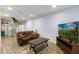 Finished basement with a cozy seating area and a spiral staircase access at 1355 Bowling Road, Fuquay Varina, NC 27526