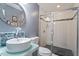 Modern bathroom with a vessel sink, walk-in shower, and stylish fixtures at 1355 Bowling Road, Fuquay Varina, NC 27526