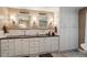 Luxurious bathroom featuring double sinks, granite countertops, and ample storage space at 1355 Bowling Road, Fuquay Varina, NC 27526