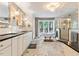 Bright bathroom with dual sink vanity, clawfoot tub, and walk-in shower at 1355 Bowling Road, Fuquay Varina, NC 27526
