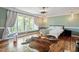 Bright bedroom with bamboo floors, large windows, and ample natural light at 1355 Bowling Road, Fuquay Varina, NC 27526