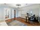 Bright bedroom with a workspace, hardwood floors, and ample natural light at 1355 Bowling Road, Fuquay Varina, NC 27526