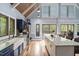Open-concept kitchen with granite countertops and ample natural light, perfect for entertaining at 1355 Bowling Road, Fuquay Varina, NC 27526