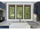 Modern kitchen with granite countertops, stainless steel appliances, and backyard view at 1355 Bowling Road, Fuquay Varina, NC 27526