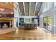 Bright, open kitchen with a fireplace, island seating, and stainless steel appliances at 1355 Bowling Road, Fuquay Varina, NC 27526