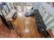 Spacious living area with hardwood floors, fireplace, large sectional sofa, and access to kitchen at 1355 Bowling Road, Fuquay Varina, NC 27526
