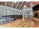 Bright and spacious living room with hardwood floors, high ceilings, a fireplace, and a spiral staircase at 1355 Bowling Road, Fuquay Varina, NC 27526
