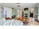 Bright and airy primary bedroom with bamboo floors, neutral decor and multiple closets at 1355 Bowling Road, Fuquay Varina, NC 27526