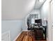 This small office features hardwood floors and a desk with computer setup, perfect for working from home at 1355 Bowling Road, Fuquay Varina, NC 27526