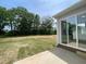 Newly sodded backyard with a concrete patio and large sliding glass doors for indoor-outdoor living at 159 Yellow River Way, Garner, NC 27529