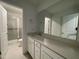 Bright bathroom with a shower, vanity, and a large mirror, offering a clean and functional space at 159 Yellow River Way, Garner, NC 27529