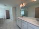 Bright bathroom featuring a dual sink vanity, large mirror, walk-in shower, and separate soaking tub at 159 Yellow River Way, Garner, NC 27529