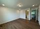 Spacious bedroom with wood floors and recessed lighting, adjacent to bathroom and hallway at 159 Yellow River Way, Garner, NC 27529