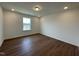 Comfortable bedroom with wood floors, a window overlooking a green view, and recessed lighting at 159 Yellow River Way, Garner, NC 27529