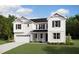 Charming two-story home with a well-manicured lawn, attached garage, and classic architectural details at 159 Yellow River Way, Garner, NC 27529