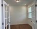 Office features French doors, a window, and hardwood floors at 159 Yellow River Way, Garner, NC 27529