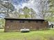 Exterior of brick home, featuring metal roof, and visible propane tank at 1622 N Carolina 98 Hwy W, Louisburg, NC 27549