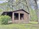 Exterior of brick home with covered porch and red front door at 1622 N Carolina 98 Hwy W, Louisburg, NC 27549