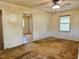 Living room featuring neutral walls, ceiling fan, and connected rooms at 1622 N Carolina 98 Hwy W, Louisburg, NC 27549