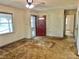Living room with a ceiling fan, neutral walls, and front entry door at 1622 N Carolina 98 Hwy W, Louisburg, NC 27549