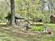 A scenic pond with a water wheel and a charming gazebo creates a backyard oasis at 1622 N Carolina 98 Hwy W, Louisburg, NC 27549