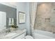 Bathroom with granite countertop and tiled shower over tub at 1809 Angelonia Way, Fuquay Varina, NC 27526