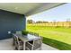 Outdoor patio with dining set overlooking spacious backyard at 1809 Angelonia Way, Fuquay Varina, NC 27526