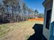Spacious backyard enclosed with an orange wooden fence, offering privacy and room to roam at 20 Willows Den Ct, Youngsville, NC 27596