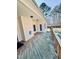 Covered wooden deck with access to the home's backyard and outdoor space at 20 Willows Den Ct, Youngsville, NC 27596