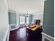 Elegant dining room with large windows, decorative molding, and a modern chandelier at 20 Willows Den Ct, Youngsville, NC 27596