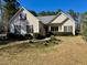 Charming one-story home with a well-maintained front yard and flower bed at 20 Willows Den Ct, Youngsville, NC 27596