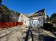Spacious two-car attached garage with driveway and partial fence in backyard at 20 Willows Den Ct, Youngsville, NC 27596