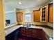 Kitchen with a view, showcasing stylish cabinets, stainless steel sink, and granite countertops at 20 Willows Den Ct, Youngsville, NC 27596