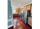 Well-lit kitchen featuring wood cabinets, granite countertops, and stainless steel appliances at 20 Willows Den Ct, Youngsville, NC 27596