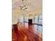 Bright living room with vaulted ceilings, fireplace, and french doors opening to the deck at 20 Willows Den Ct, Youngsville, NC 27596