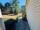 A sidewalk runs alongside the home, providing access to a lush side yard with mature trees at 20 Willows Den Ct, Youngsville, NC 27596