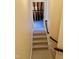 Carpeted staircase leading to an unfinished attic space at 20 Willows Den Ct, Youngsville, NC 27596